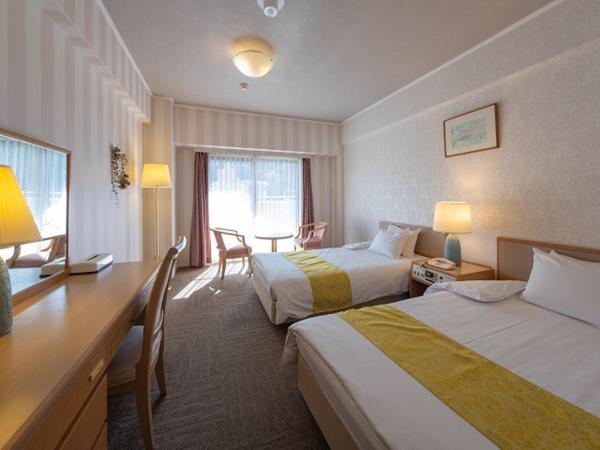 Merveille Arima : photo 1 de la chambre chambre lits jumeaux