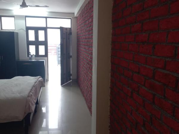 Pitrashish Serenity Homes : photo 3 de la chambre chambre double deluxe (2 adultes + 1 enfant)