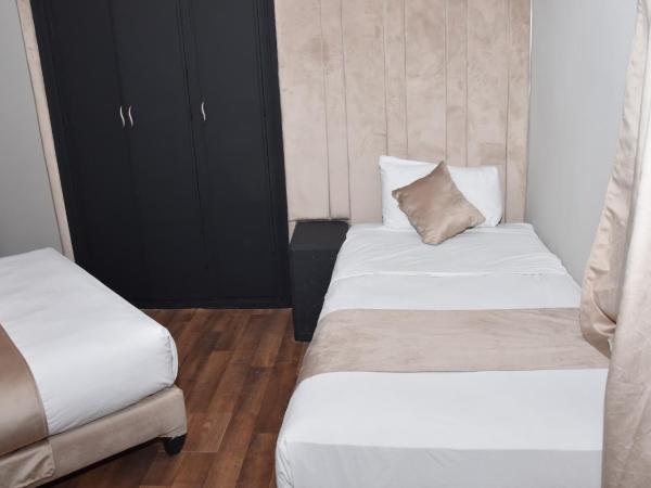 Cadé Hotel : photo 7 de la chambre chambre triple