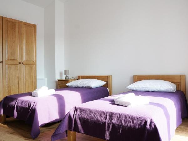 Guest house Jere Old Town : photo 1 de la chambre chambre double ou lits jumeaux avec lit d'appoint