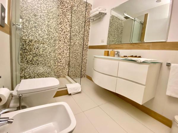 Palazzo Mele Residence : photo 2 de la chambre chambre double ou lits jumeaux supérieure - vue sur jardin