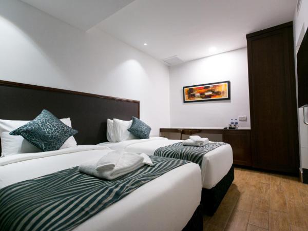 Belllo Hotel JB Central : photo 5 de la chambre chambre premier lit queen-size ou lits jumeaux