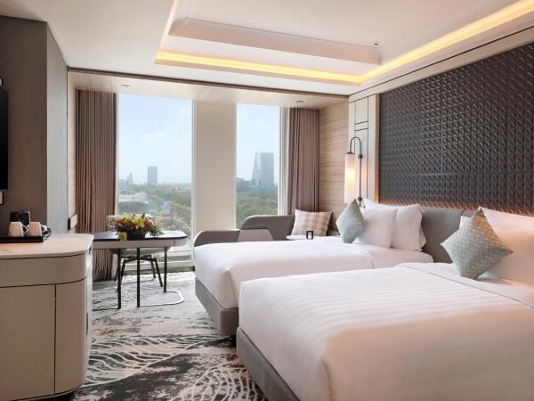 Movenpick Surabaya City : photo 1 de la chambre chambre lits jumeaux deluxe - vue sur ville