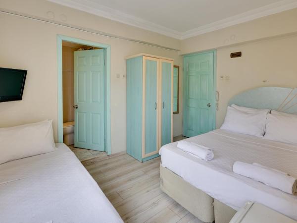 Hikmethan Otel : photo 1 de la chambre chambre triple avec balcon