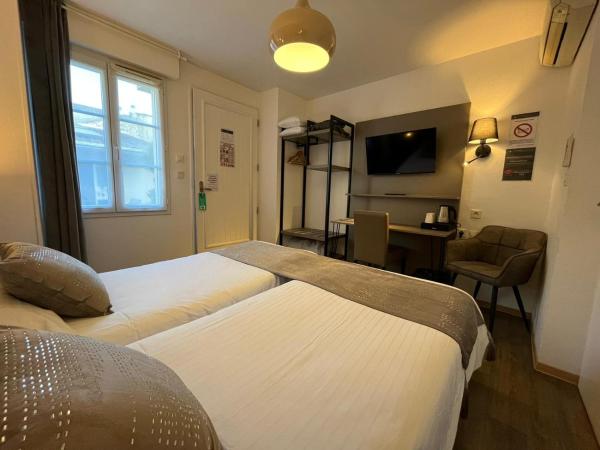 Cit'Hotel Le Cheval Blanc Cognac Centre : photo 2 de la chambre chambre lits jumeaux