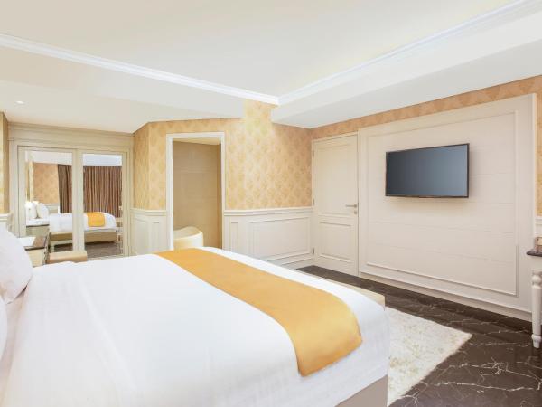 Grand Rohan Jogja : photo 1 de la chambre suite lit king-size avec balcon