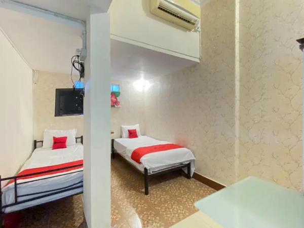 RedDoorz Syariah at Prapen Jaya Surabaya : photo 3 de la chambre chambre lits jumeaux standard