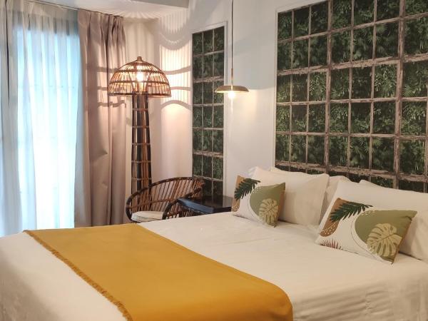Le Petit Boutique Hotel : photo 1 de la chambre chambre lit queen-size - vue sur jardin