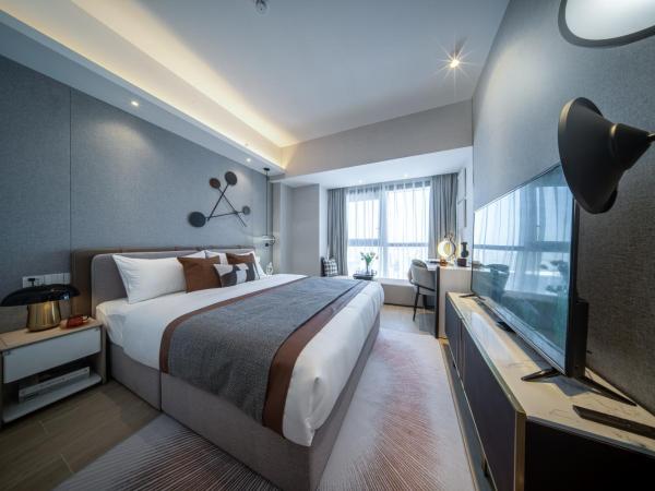 BORUISI Executive Apartment : photo 3 de la chambre chambre exécutive lit queen-size