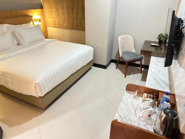 d'primahotel Jemursari Surabaya : photo 4 de la chambre chambre double ou lits jumeaux supérieure