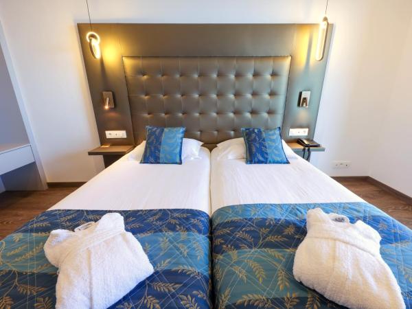 Hotel Saint Christophe : photo 5 de la chambre chambre lits jumeaux supérieure - vue partielle sur la mer