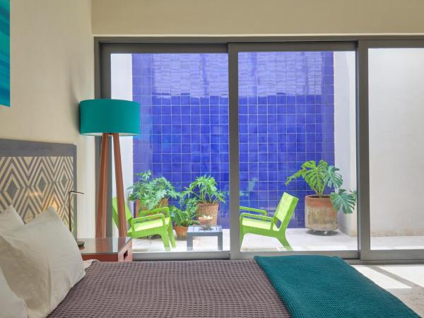 El Pueblo Mérida : photo 1 de la chambre suite deluxe avec lit king-size