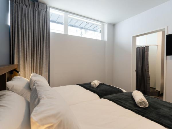 Haka House Auckland City : photo 2 de la chambre chambre lits jumeaux avec salle de bains privative