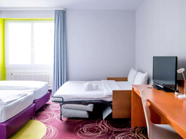 ibis Styles Luzern : photo 4 de la chambre chambre lits jumeaux standard avec canapé