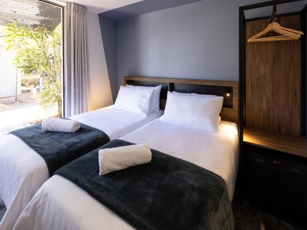 Haka House Rotorua : photo 1 de la chambre chambre lits jumeaux avec salle de bains privative