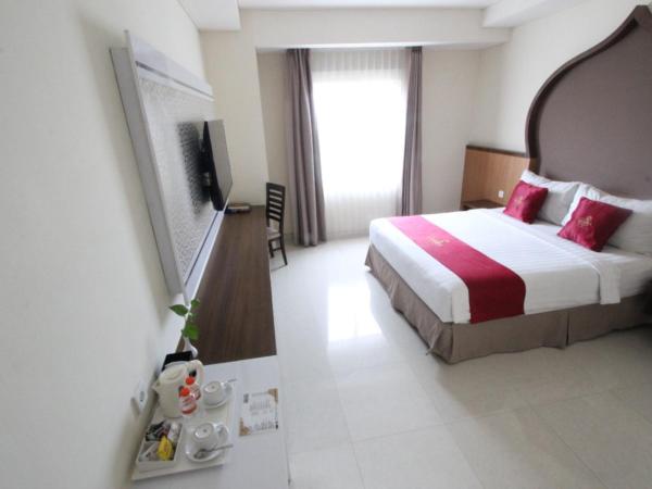 Namira Syariah Hotel Surabaya : photo 1 de la chambre chambre double ou lits jumeaux supérieure avec vue sur ville