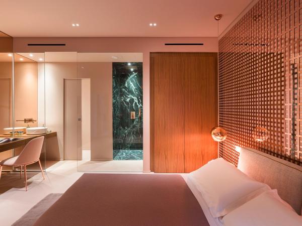 Taormina Infinity Suites : photo 2 de la chambre suite lit queen-size