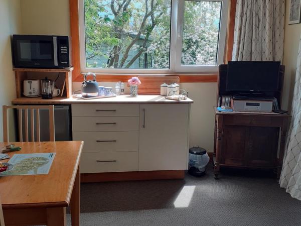 Magnolia Cottage : photo 9 de la chambre suite - vue sur jardin