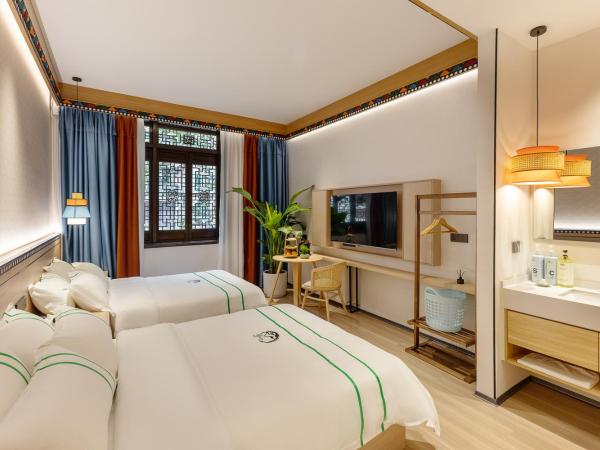 Xishu Garden Inn : photo 1 de la chambre chambre lits jumeaux standard