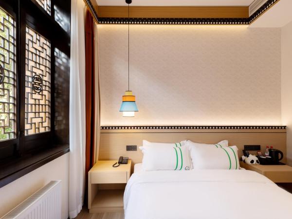 Xishu Garden Inn : photo 1 de la chambre chambre simple avec douche 