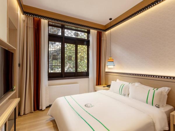 Xishu Garden Inn : photo 2 de la chambre chambre simple avec douche 