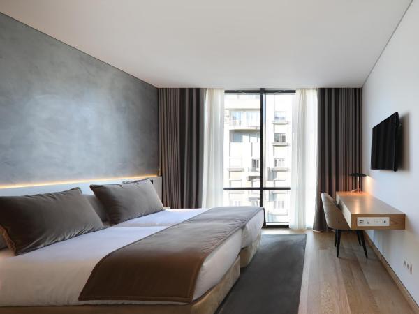 Iberostar Selection Lisboa : photo 1 de la chambre chambre double supérieure - vue sur ville