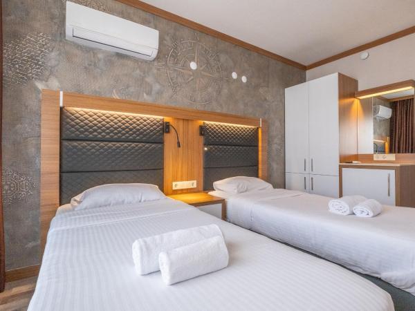 Hotel Sunday Beach : photo 3 de la chambre chambre lits jumeaux avec vue sur l'arrière-pays