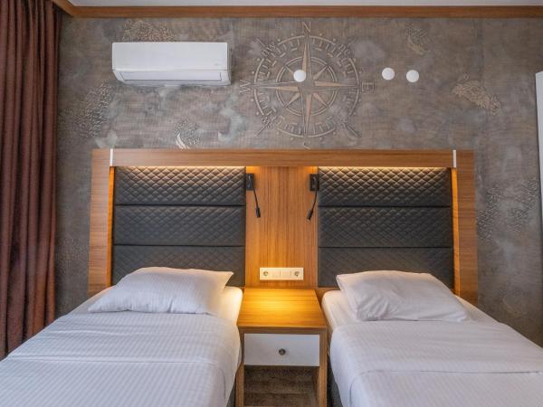 Hotel Sunday Beach : photo 6 de la chambre chambre lits jumeaux avec vue sur l'arrière-pays