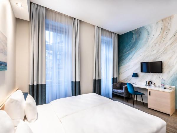 Atrium Fashion Hotel : photo 1 de la chambre chambre double ou lits jumeaux deluxe - vue sur ville