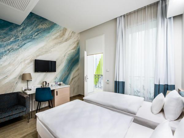 Atrium Fashion Hotel : photo 1 de la chambre chambre double ou lits jumeaux – vue sur atrium
