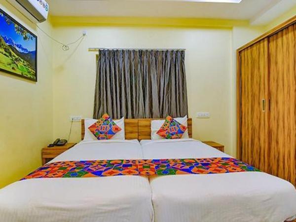 FabExpress Purple Suites Inn : photo 2 de la chambre chambre deluxe