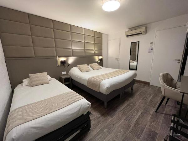 Cit'Hotel Le Cheval Blanc Cognac Centre : photo 8 de la chambre chambre quadruple avec 1 lit double et 2 lits simples