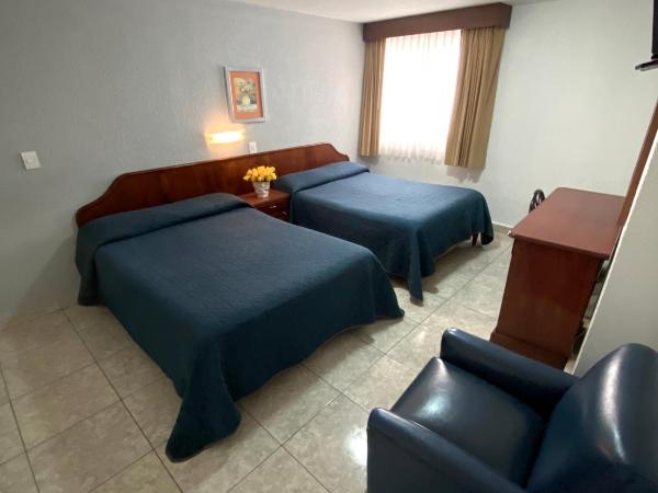 Hotel Qualitel Plus : photo 5 de la chambre chambre avec 2 lits doubles