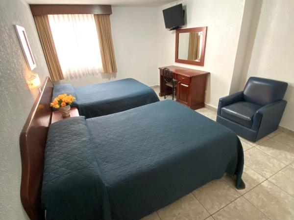 Hotel Qualitel Plus : photo 7 de la chambre chambre avec 2 lits doubles