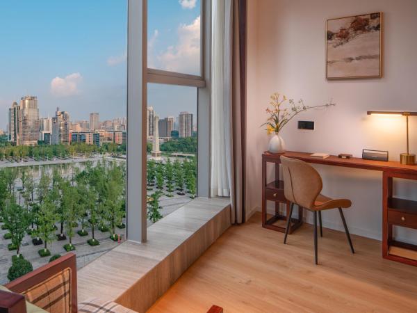 Xunguang Hotel - Chongqing Liangjiang Happiness Plaza : photo 4 de la chambre chambre lits jumeaux deluxe