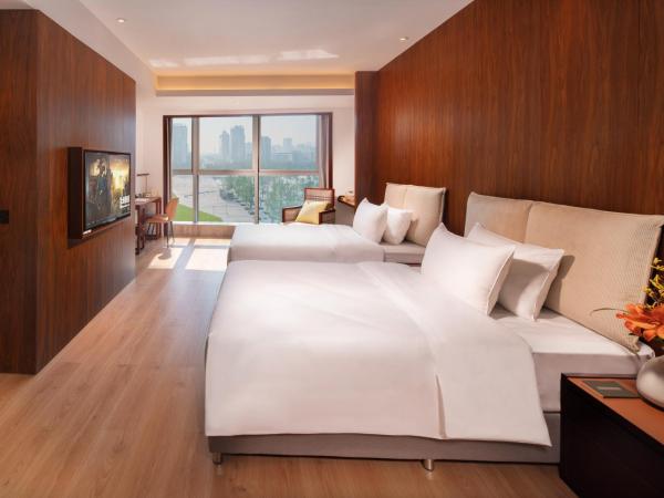 Xunguang Hotel - Chongqing Liangjiang Happiness Plaza : photo 1 de la chambre chambre lits jumeaux deluxe