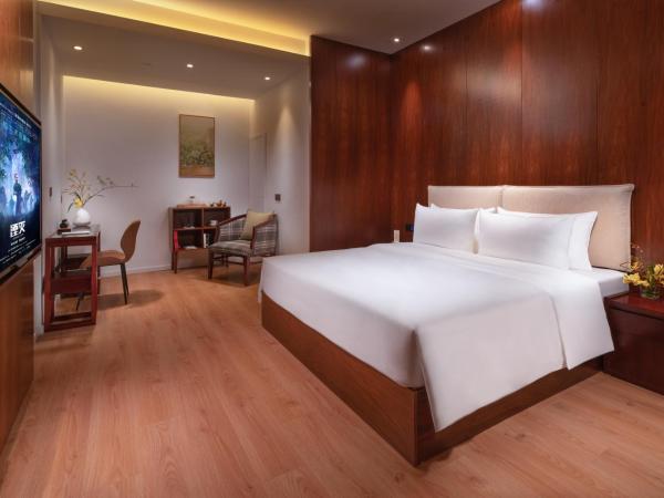 Xunguang Hotel - Chongqing Liangjiang Happiness Plaza : photo 2 de la chambre chambre standard lit queen-size