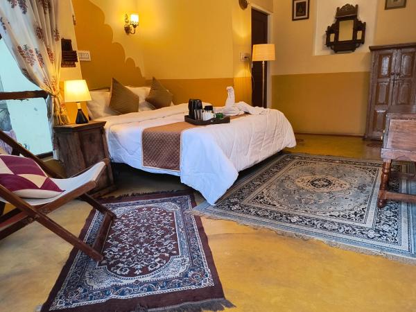 Raj Haveli- A Heritage Samode : photo 2 de la chambre chambre deluxe (2 adultes + 1 enfant)