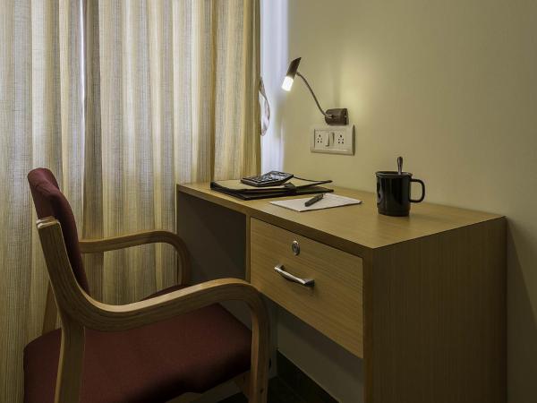 Treebo Akshaya Mayflower Vijaya Bank Layout : photo 8 de la chambre [sanitized] single room