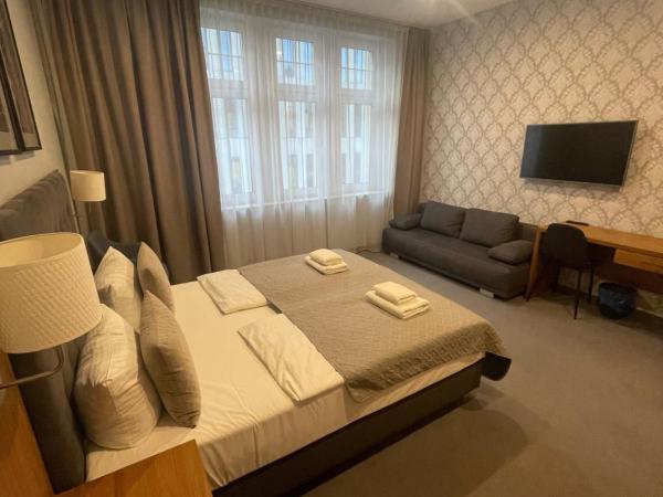 Brassel Aparthotel : photo 3 de la chambre chambre double avec lit d'appoint