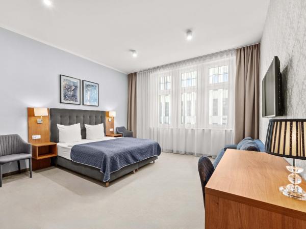 Brassel Aparthotel : photo 1 de la chambre chambre double avec lit d'appoint