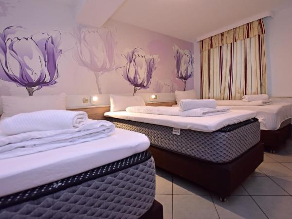 Ambiente by Next Inn : photo 3 de la chambre chambre triple avec salle de bains privative