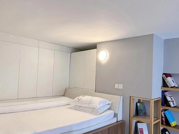 广州沃家国际公寓 : photo 6 de la chambre chambre double ou lits jumeaux deluxe - vue sur ville 
