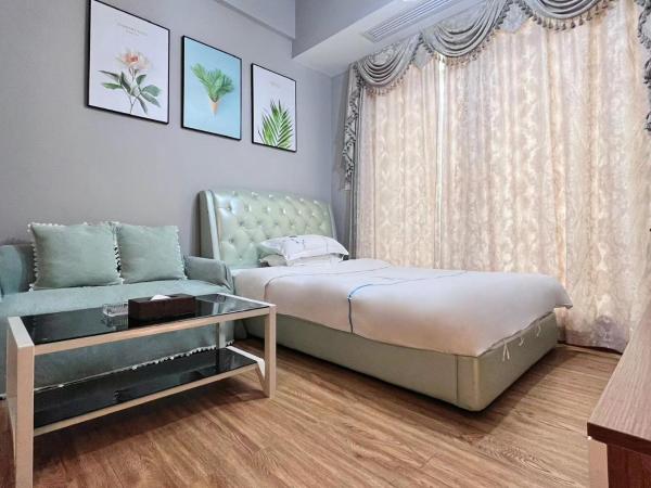 广州沃家国际公寓 : photo 2 de la chambre chambre double ou lits jumeaux deluxe - vue sur ville 