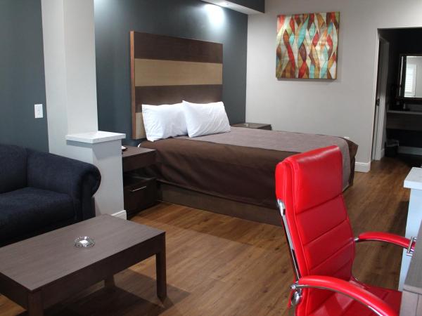 Grand Villa Inn and Suites Westchase/Chinatown : photo 1 de la chambre suite lit king-size