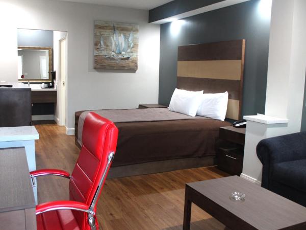 Grand Villa Inn and Suites Westchase/Chinatown : photo 2 de la chambre suite lit king-size