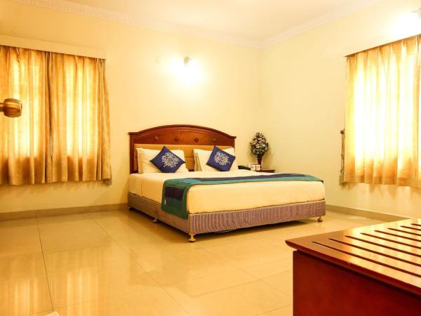 OYO Chevron Orchards Near Snow City : photo 1 de la chambre chambre triple deluxe