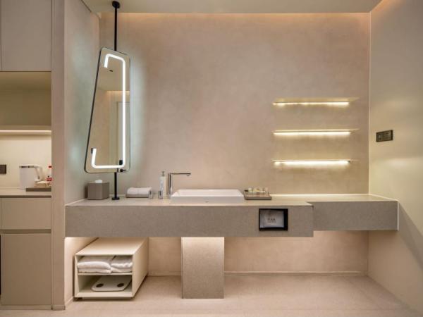 Hilton Garden Inn Nanjing Hexi Olympic Sports Center : photo 8 de la chambre chambre lit king-size premium avec canapé-lit