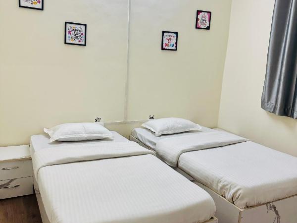 Elite Stays Viman nagar : photo 1 de la chambre chambre double ou lits jumeaux avec salle de bains privative