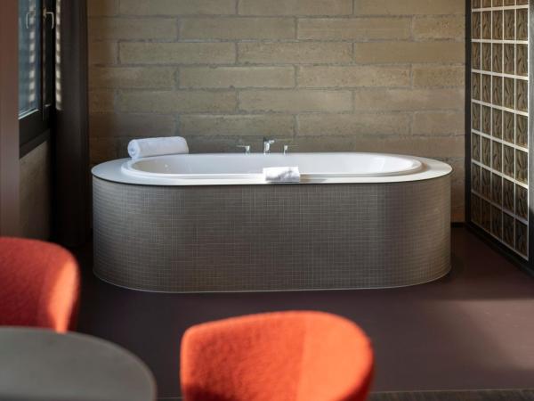 Tailormade Hotel LEO St Gallen : photo 5 de la chambre hébergement lit king-size premium